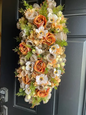 Orange floral swag for door