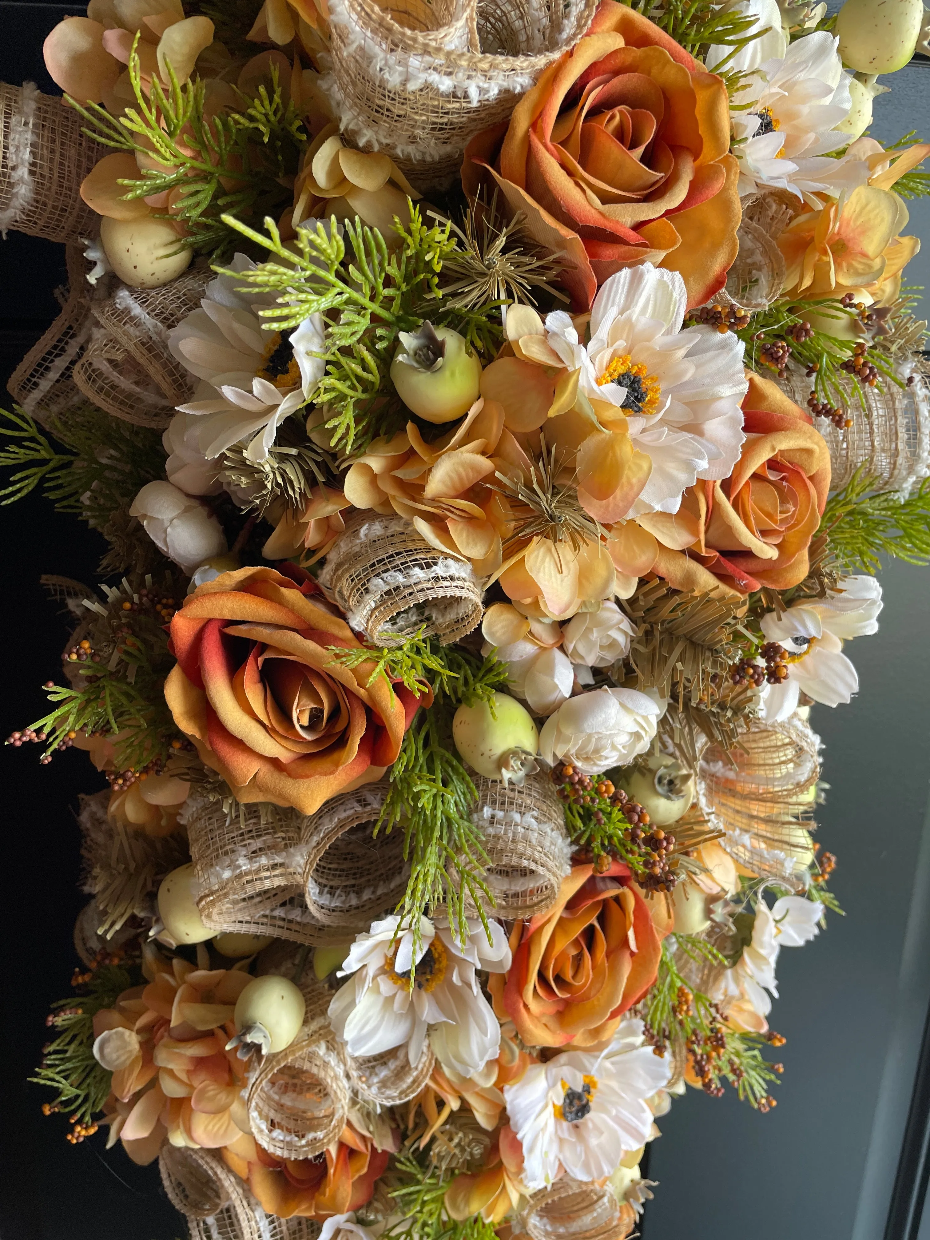 Orange floral swag for door