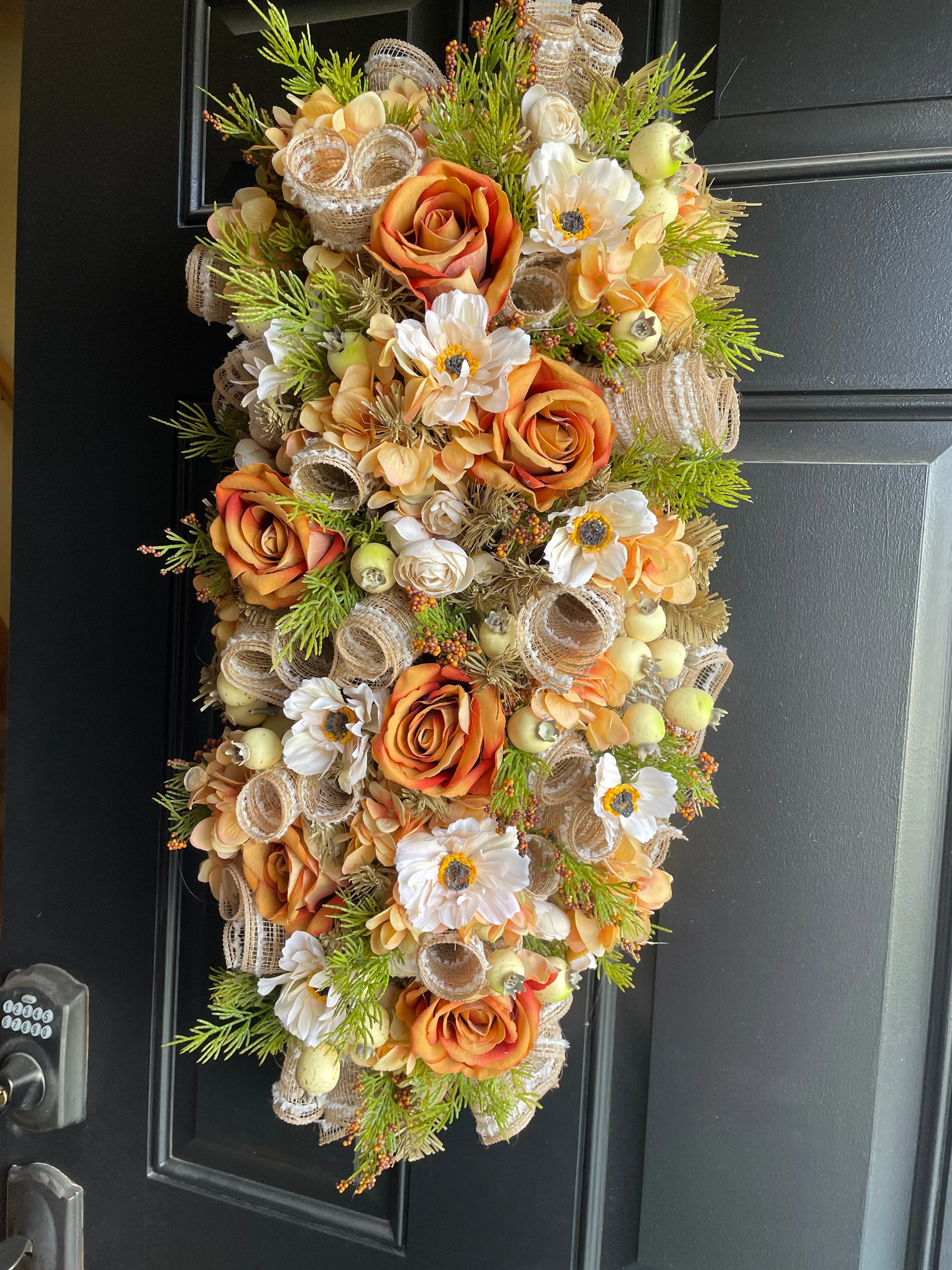 Orange floral swag for door